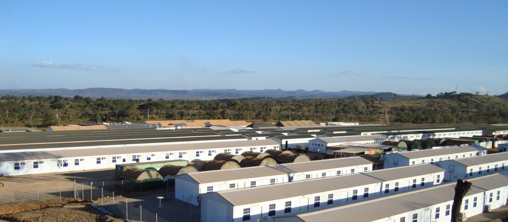Panoramic view of a large modular workforce camp in the African bush